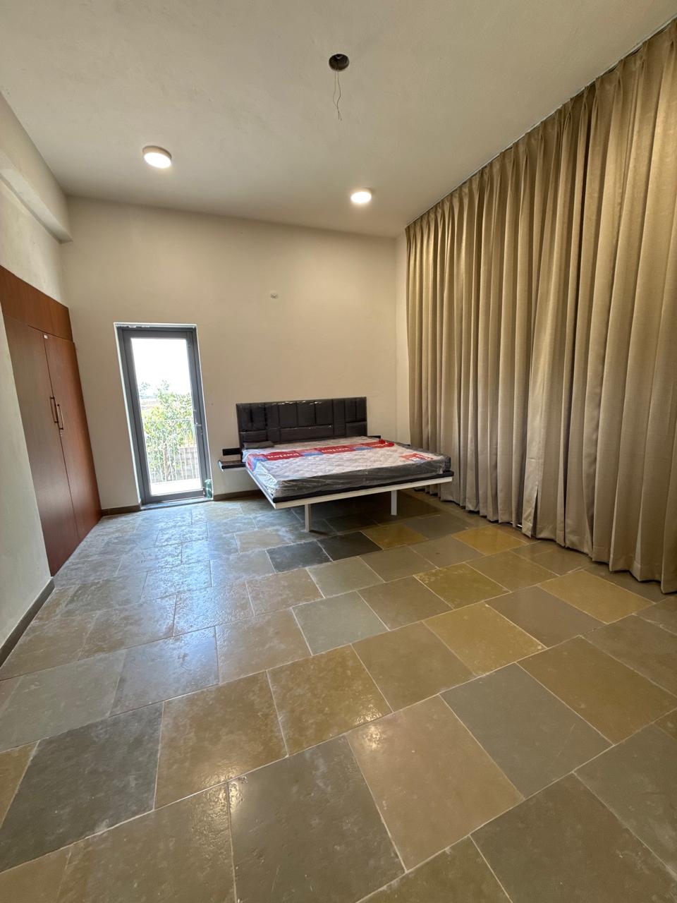 Luxury master bedroom with balcony view